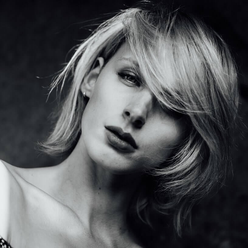 Black and white photo of a model with makeup by Bristol makeup artist Evie Smith.