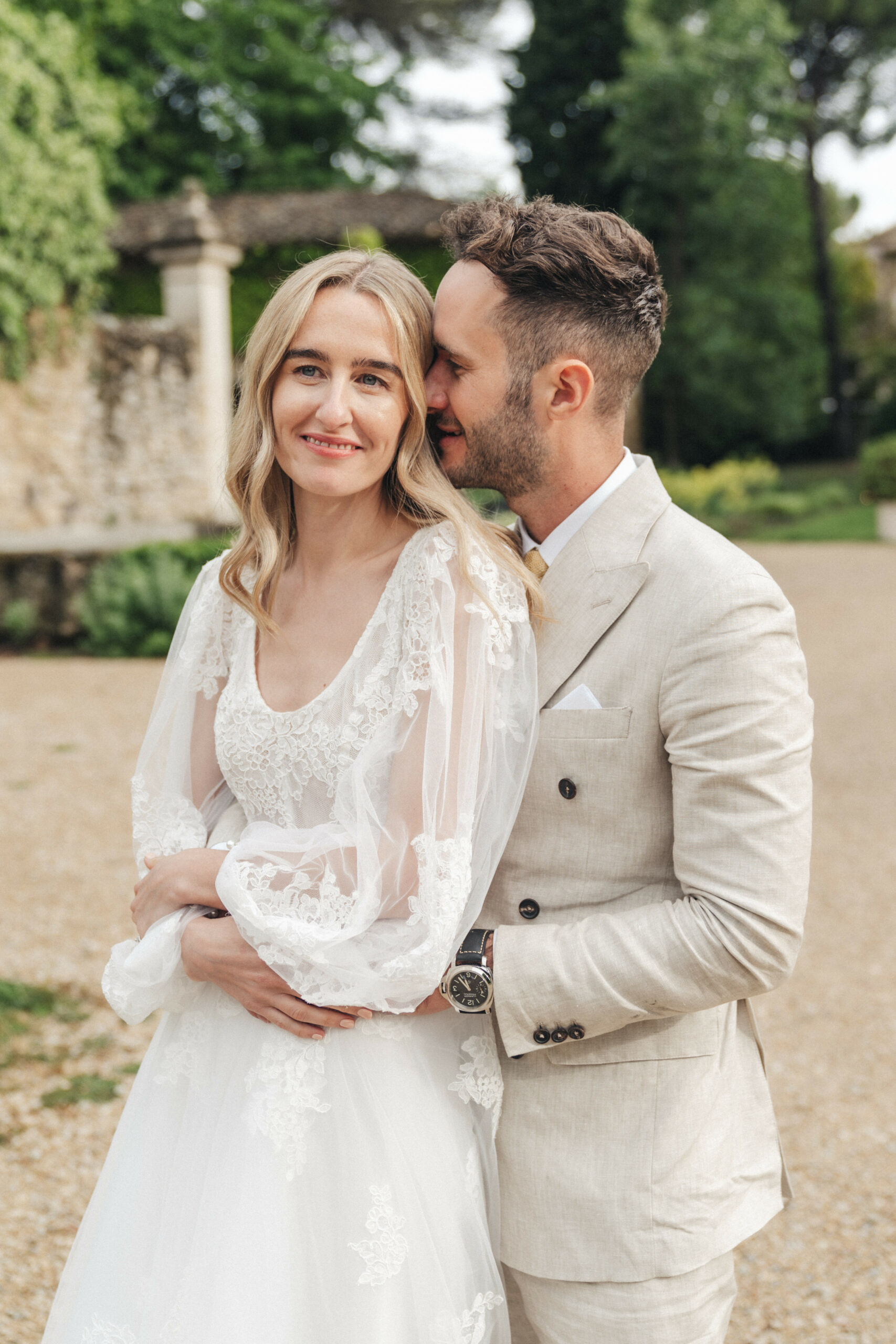 Happy bride and groom embracing on their wedding day.