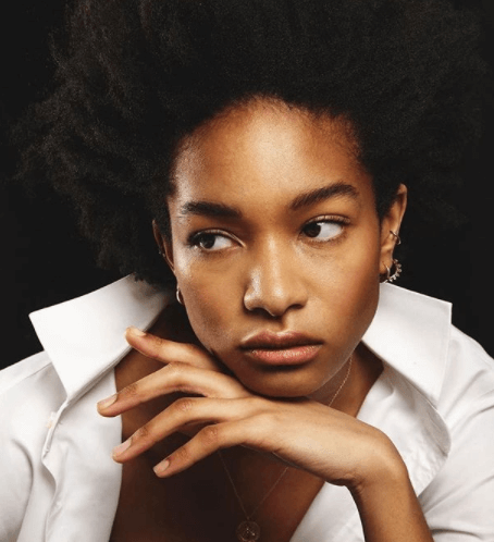 Female model posing on shoot with makeup by Bristol makeup artist Evie Smith.