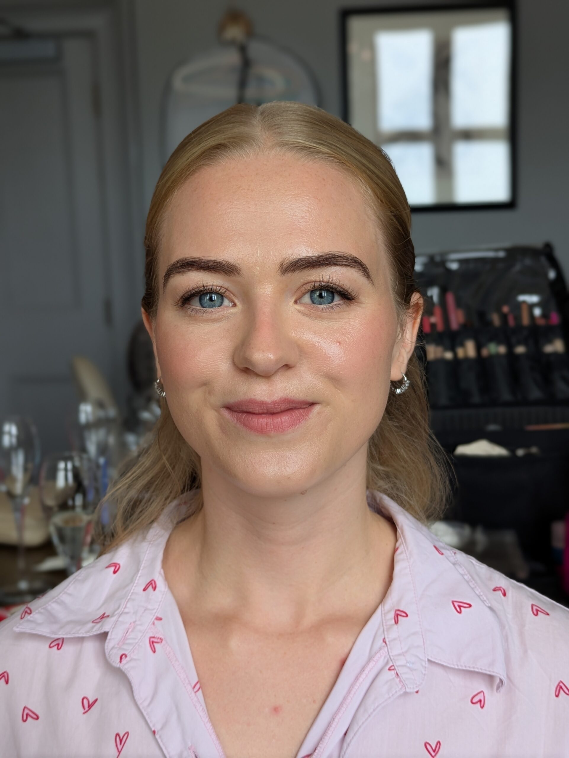 blonde bride at clevedon hall looking directly into the camera after having her hair and makeup done by a bristol makeup artist